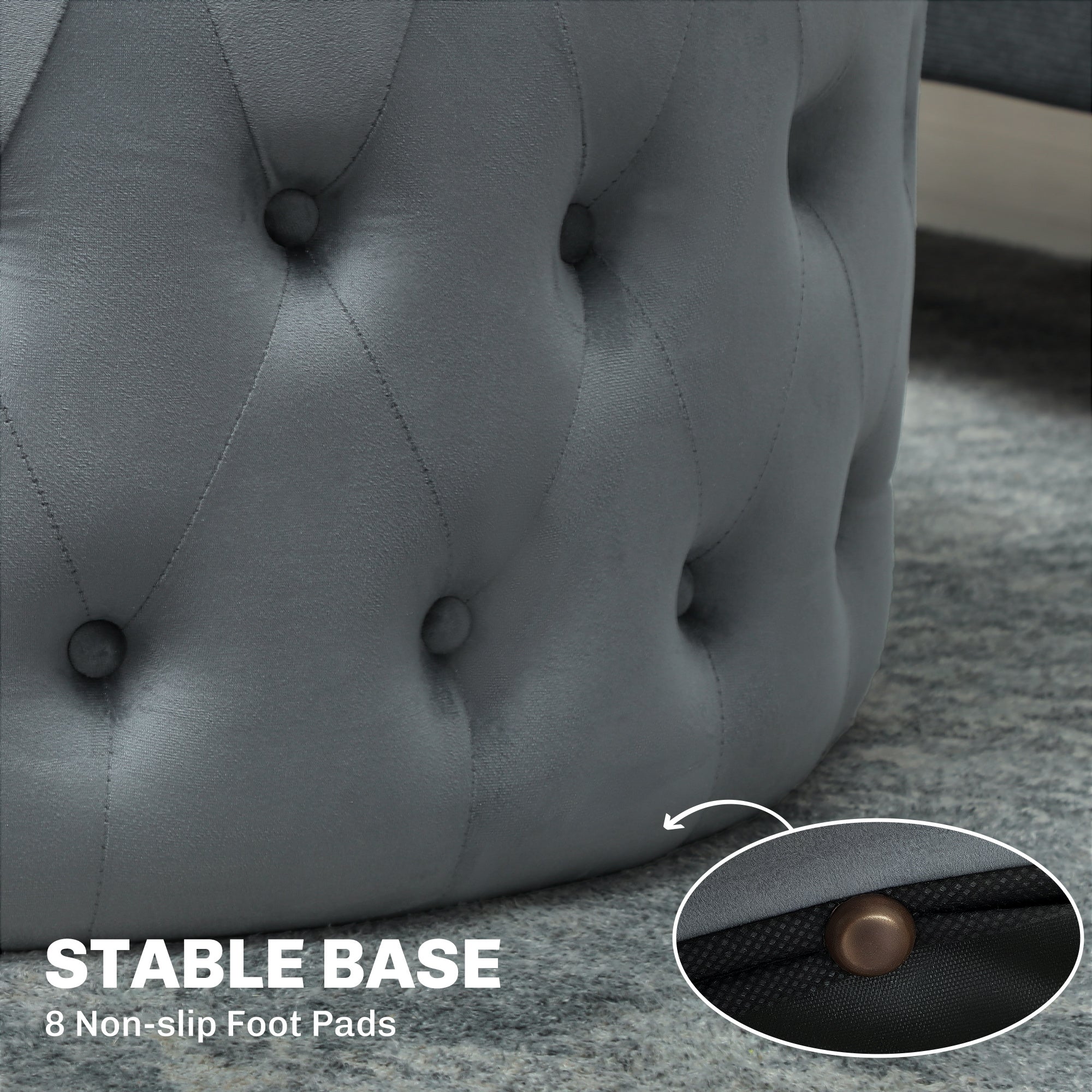 Gray tufted ottoman with non-slip foot pads on a carpeted floor