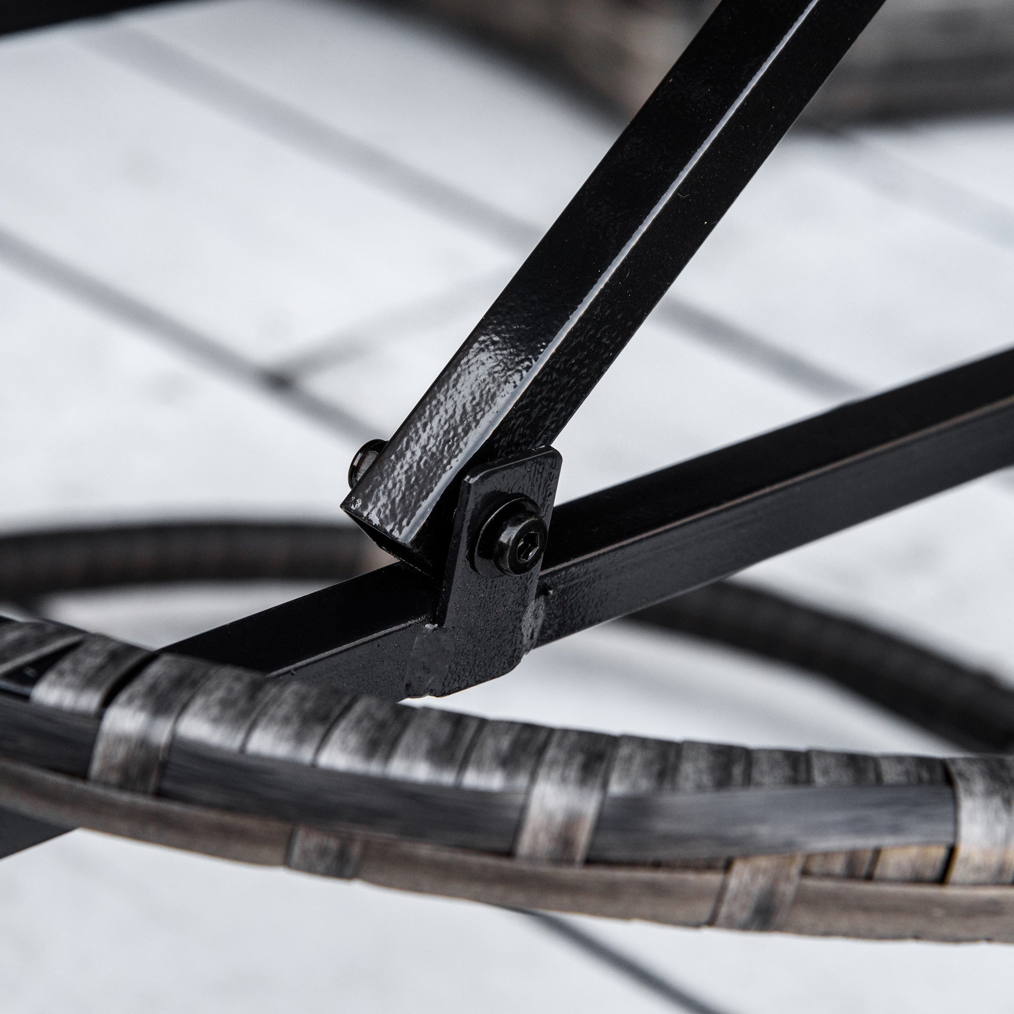 Close-up of a bicycle wheel with a focus on the rim and spokes.