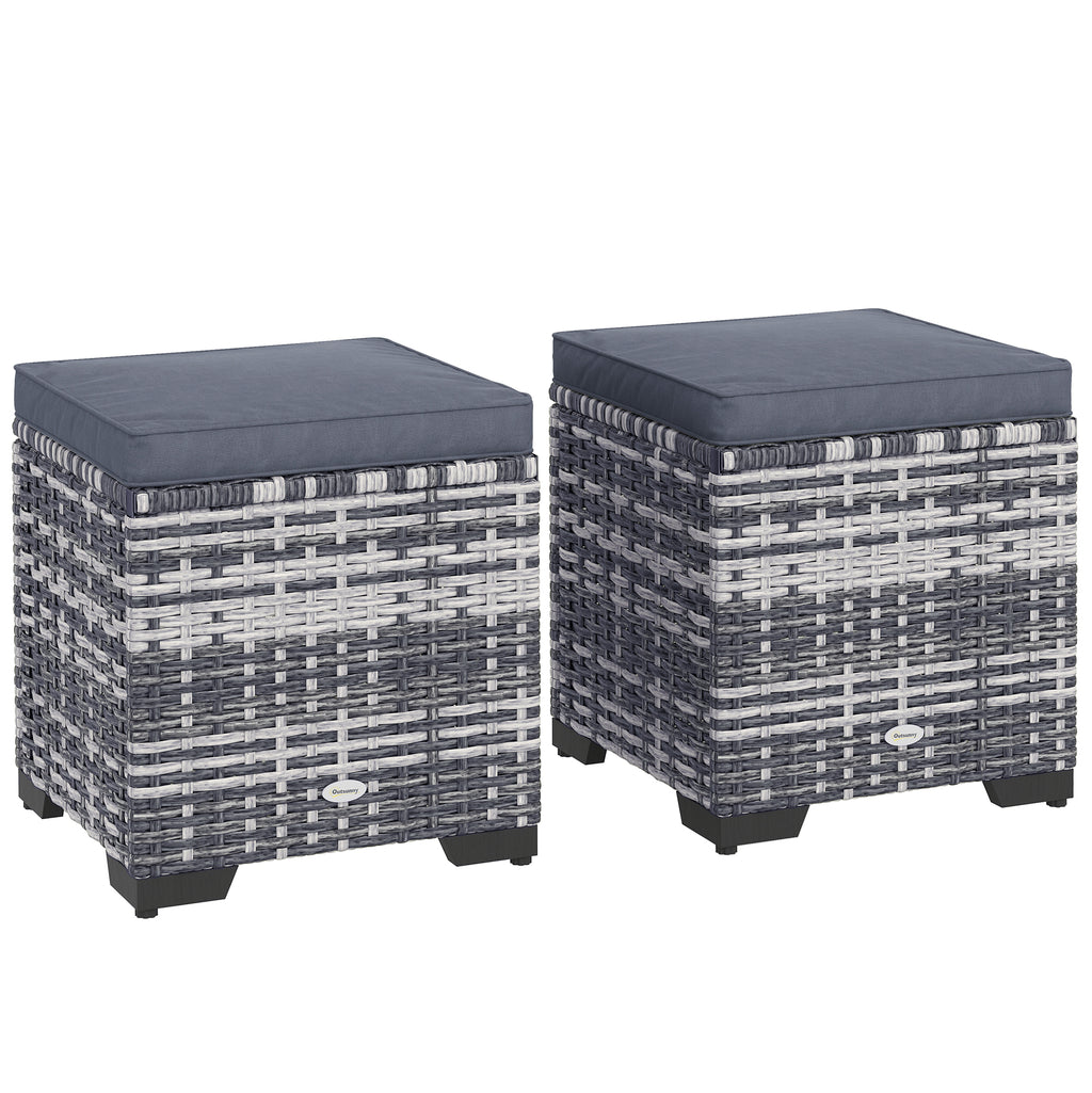 Two woven stools with dark cushions on a white background